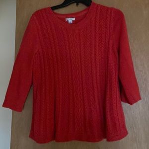 Large red-orange sweater